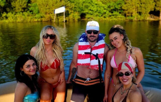 Group of friends hanging out on a pontoon boat with Rowdy Boats located in Nashville Tennessee at Percy Priest Lake