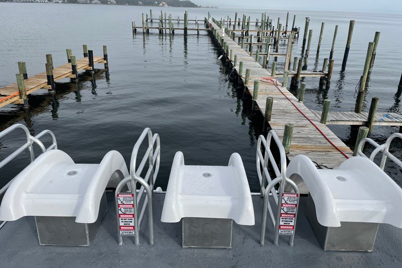 top deck view of the 3 slides on the party boat at the dock