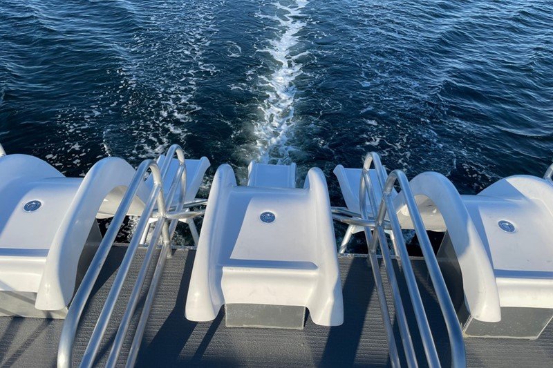 top deck view of the 3 slides on the party boat on the water