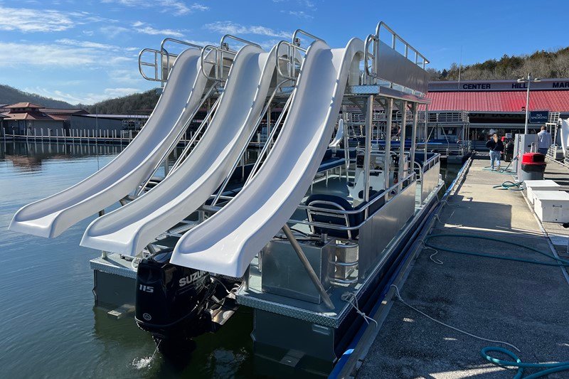 rear view of the triple slide party boat at the dock