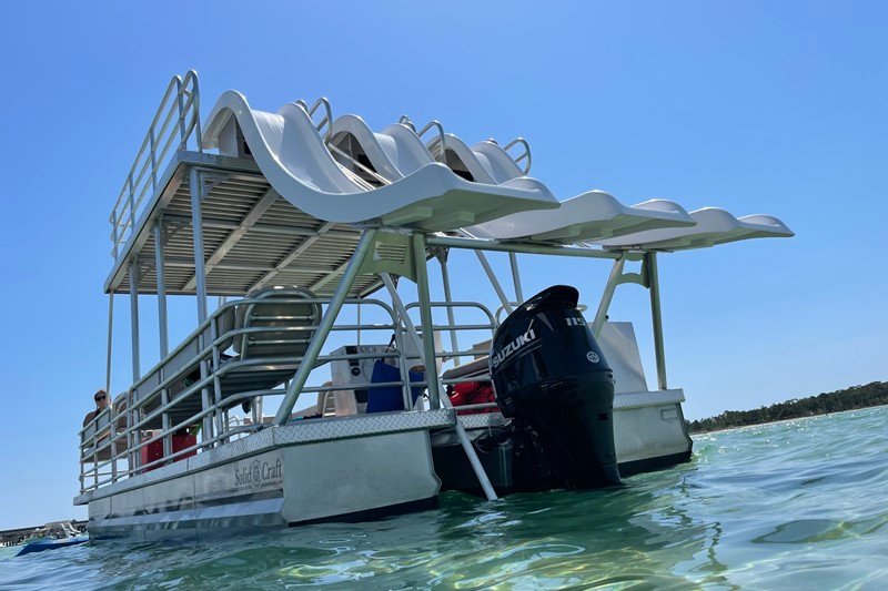 water view of the triple slide party boat from rowdy boats