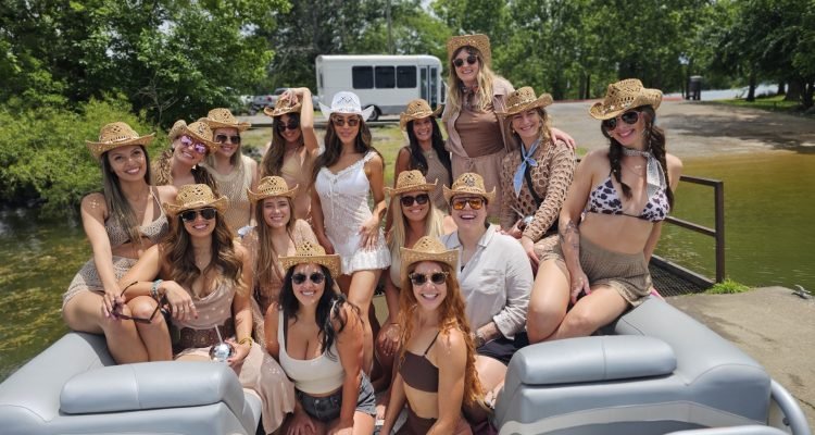 Bachelorettes hanging out a percy priest lake on a slide pontoon boat in Nashville, Tennessee